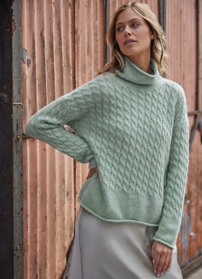 model in mint cream sweater